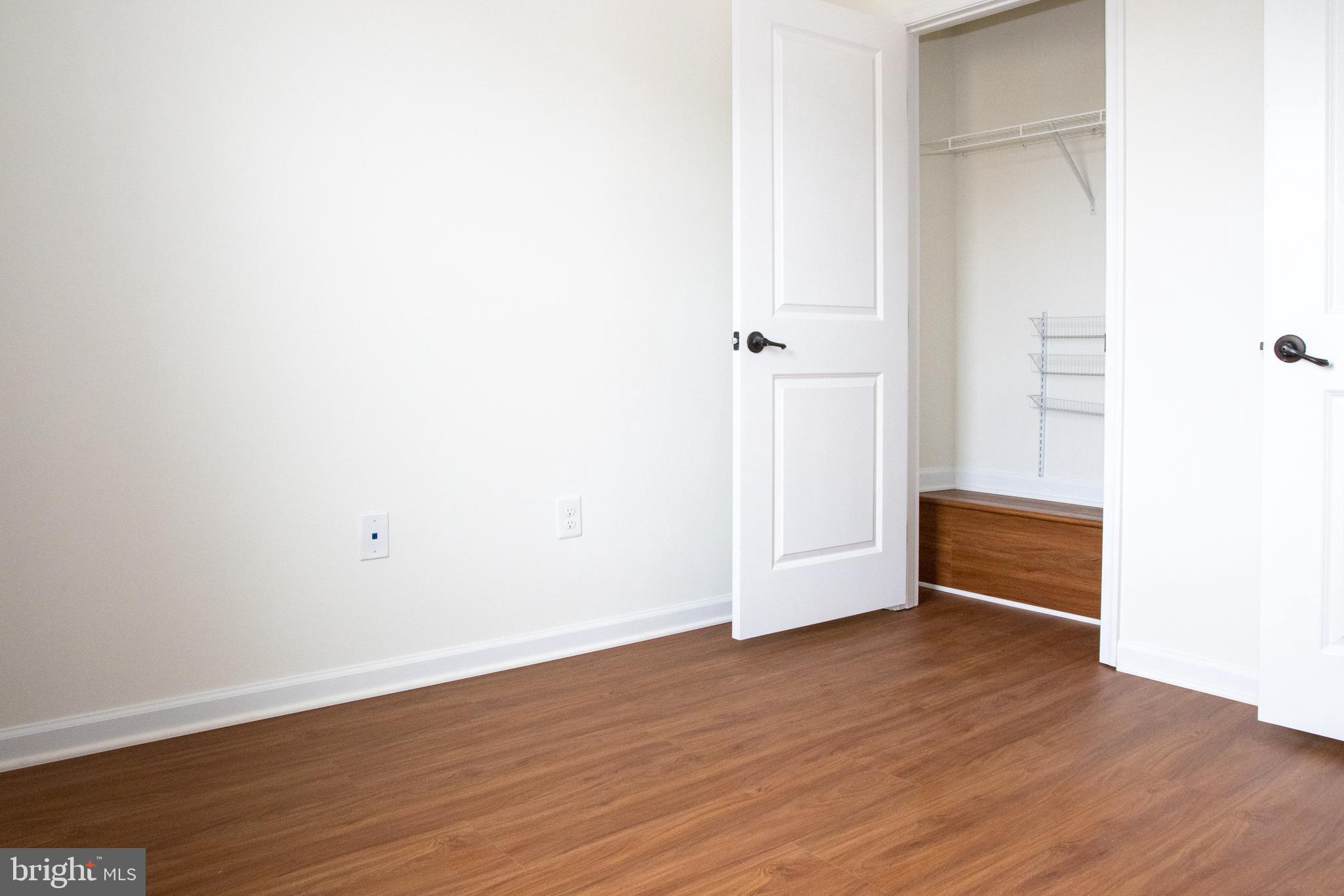 7317 Summit Rock Road Elkridge, MD 21075 - Photo 24 of 36 a view of an empty room with wooden floor