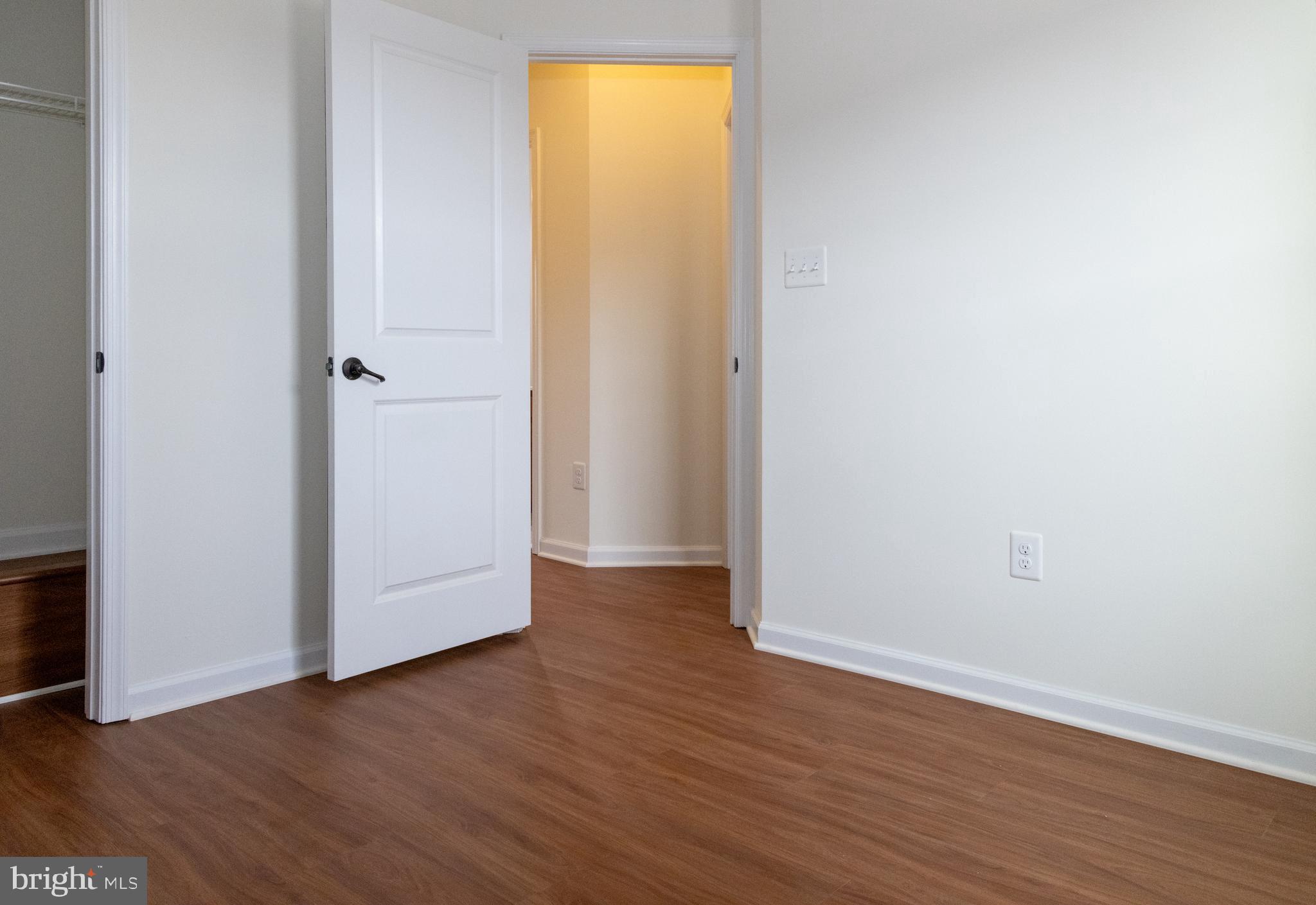 7317 Summit Rock Road Elkridge, MD 21075 - Photo 25 of 36 a view of an empty room with wooden floor and a window