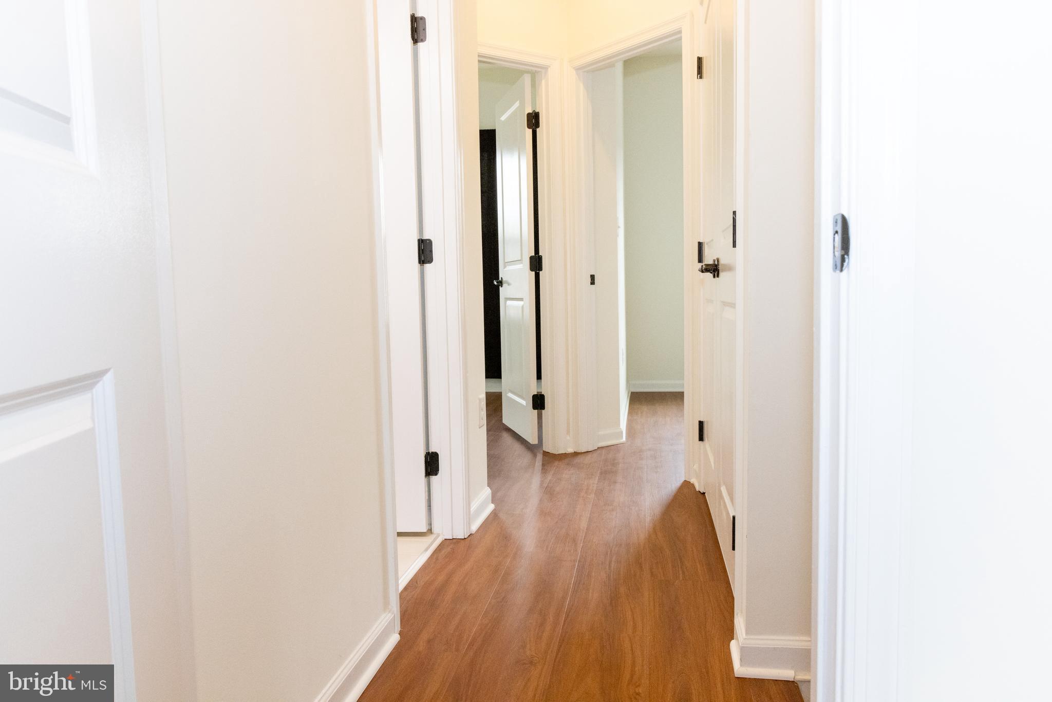 7317 Summit Rock Road Elkridge, MD 21075 - Photo 30 of 36 a view of a hallway with wooden floor