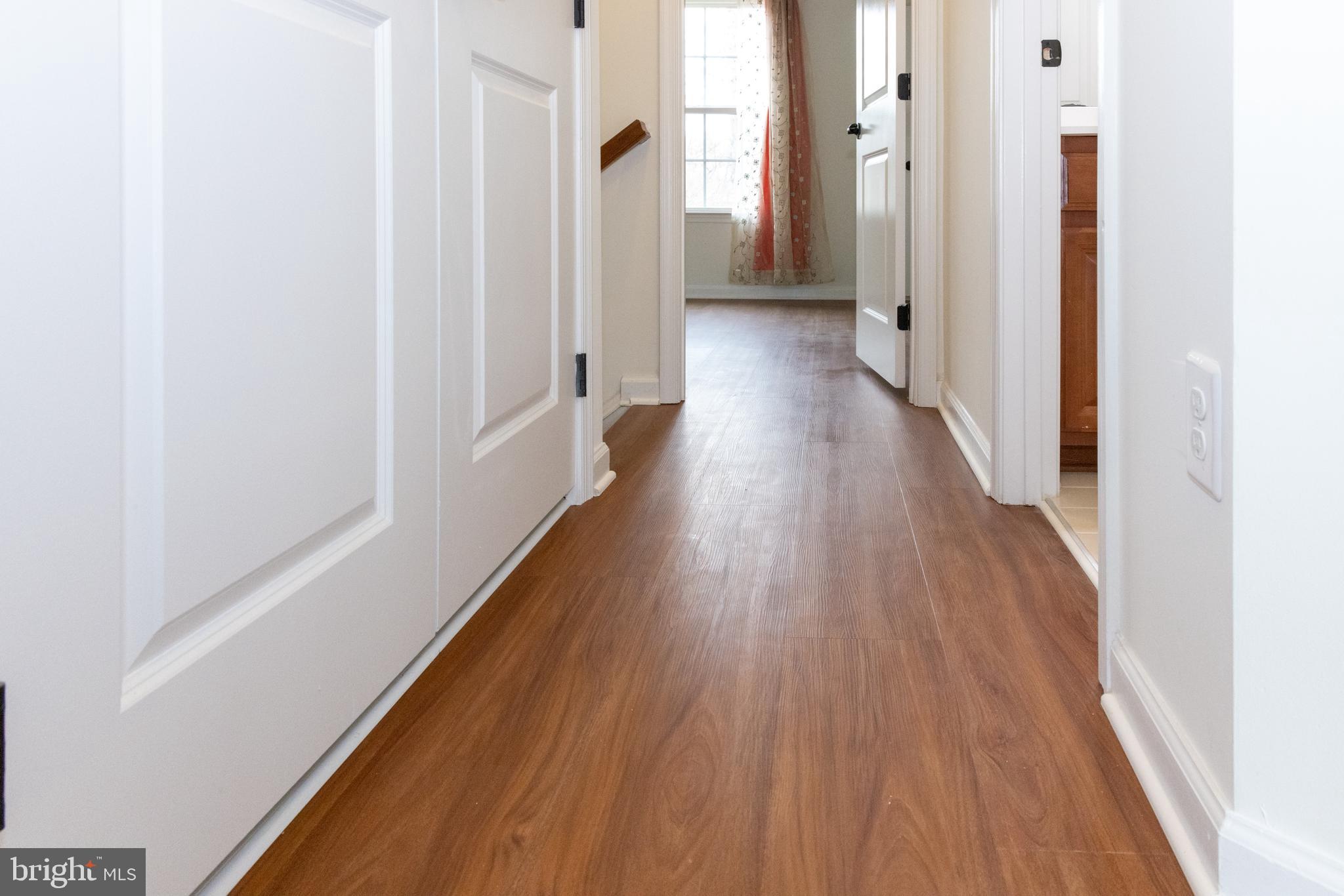 7317 Summit Rock Road Elkridge, MD 21075 - Photo 33 of 36 a view of a hallway with wooden floor