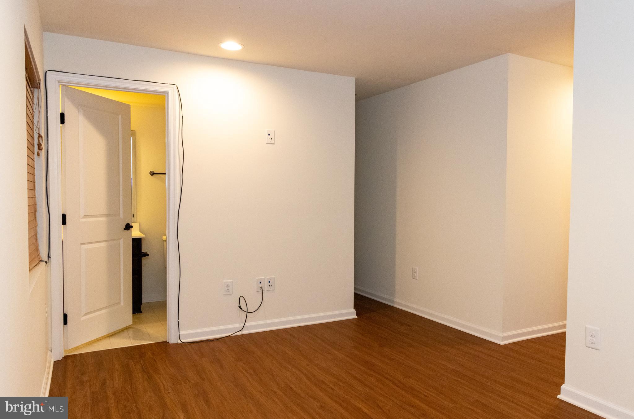 7317 Summit Rock Road Elkridge, MD 21075 - Photo 5 of 36 a view of an empty room with wooden floor and closet