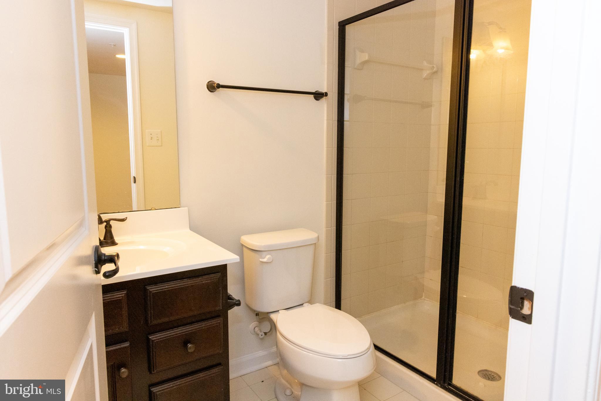 7317 Summit Rock Road Elkridge, MD 21075 - Photo 6 of 36 a bathroom with a sink vanity mirror and toilet