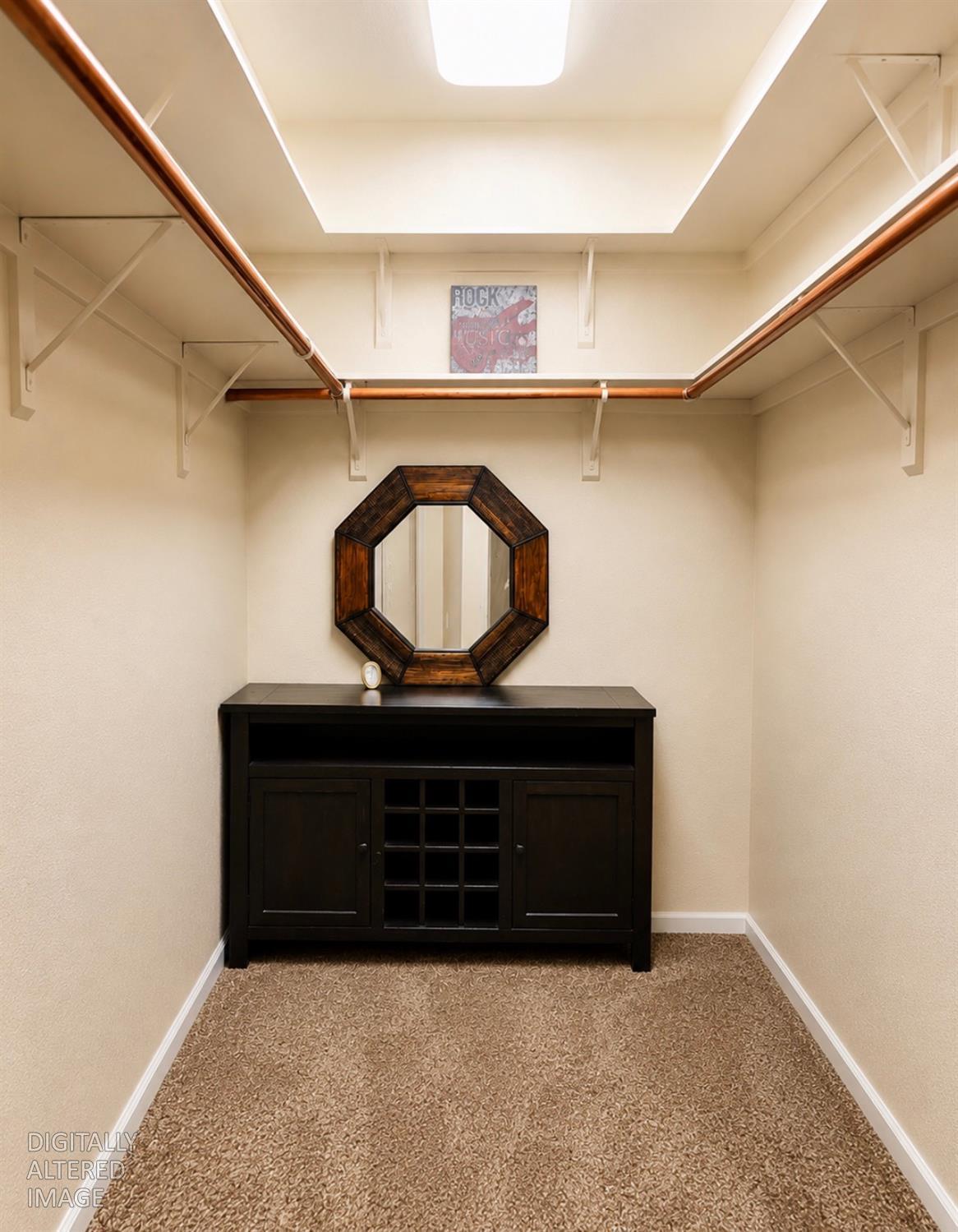 611 Sunrise Road Copperopolis, CA 95228 - Photo 13 of 29 a living room with a mirror and a wooden floor