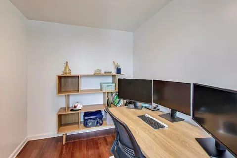 a bedroom with a bed and a table