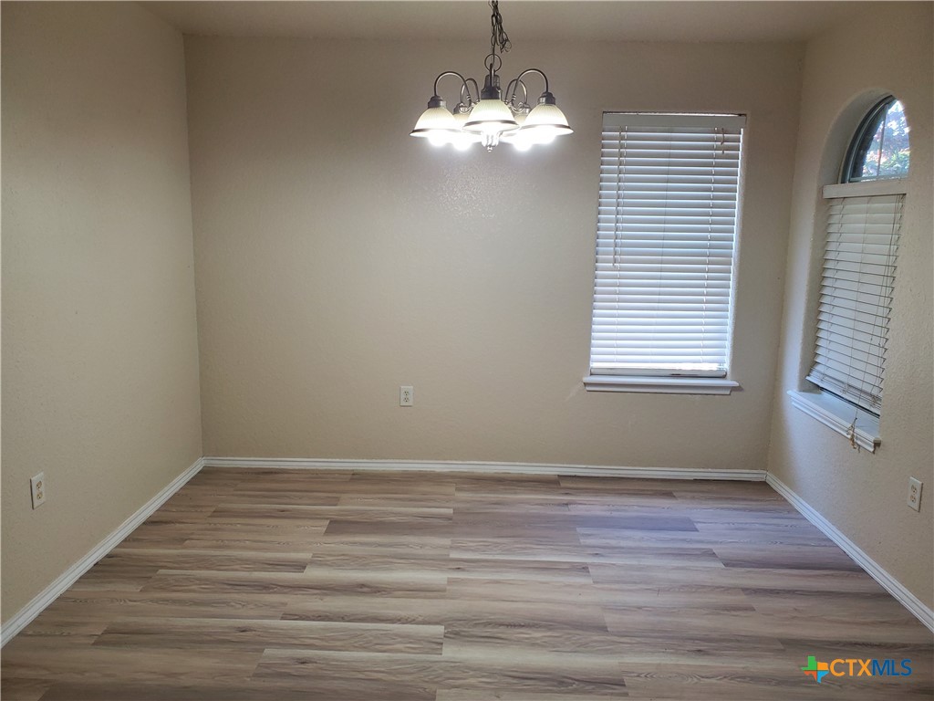 3413 Rob Roy Street Seguin, TX 78155 - Photo 2 of 13 a view of a room with wooden floor and windows