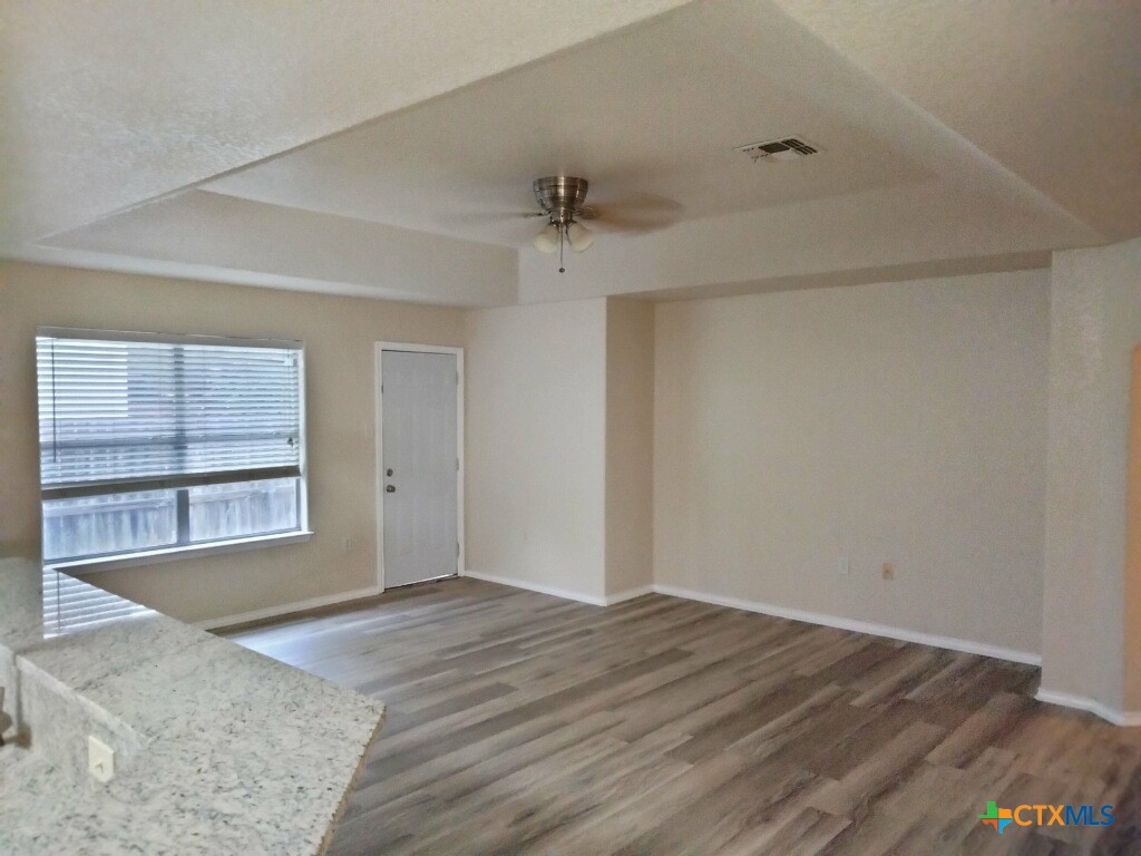 3413 Rob Roy Street Seguin, TX 78155 - Photo 9 of 13 an empty room with windows and cabinet