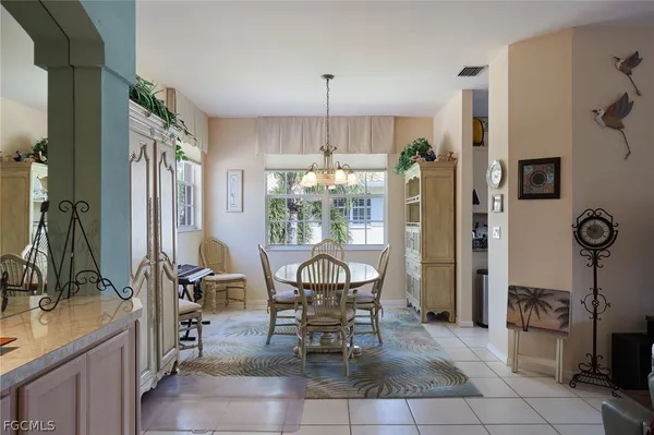 $499,999 | 25051 Ballycastle Court, Unit 201, Bonita Springs, FL 34134