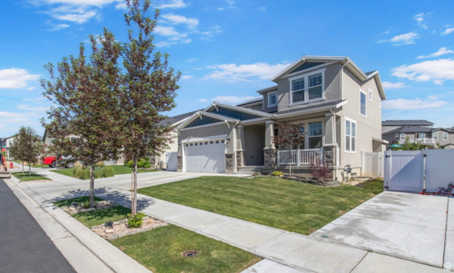 1295 East Granite Peak Road Eagle Mountain, UT 84005 - Photo 2 of 35 Contemporary two-story exterior with a two-car garage