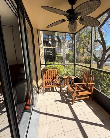 a view of a balcony with chairs