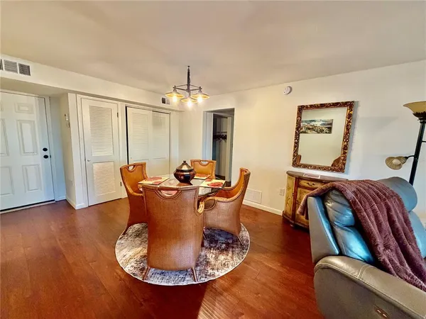 a kitchen with stainless steel appliances granite countertop a refrigerator and a stove