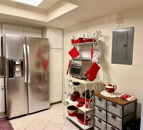 a kitchen with stainless steel appliances kitchen island a stove a sink and a microwave