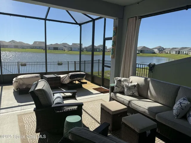 a balcony with furniture and outdoor view