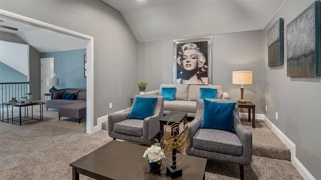 a view of a livingroom with furniture and a window