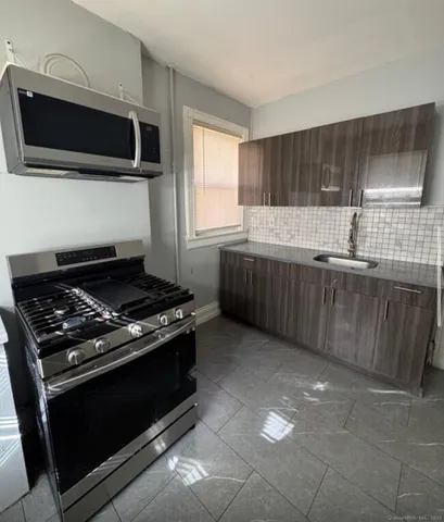 a kitchen with a stove and a microwave