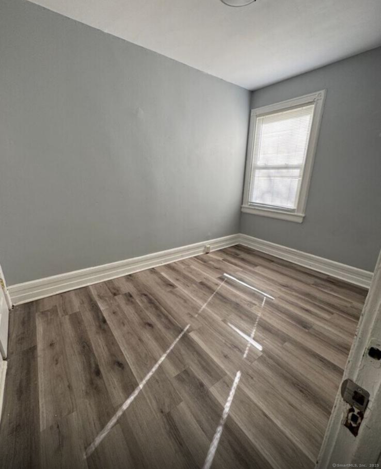 301 Dover Street, Unit 1 Bridgeport, CT 06610 - Photo 4 of 4 a view of a room with rack on the wall