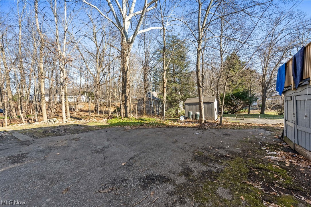 4661 Liberty Road Cleveland, OH 44121 - Photo 40 of 42 View of yard featuring a storage shed