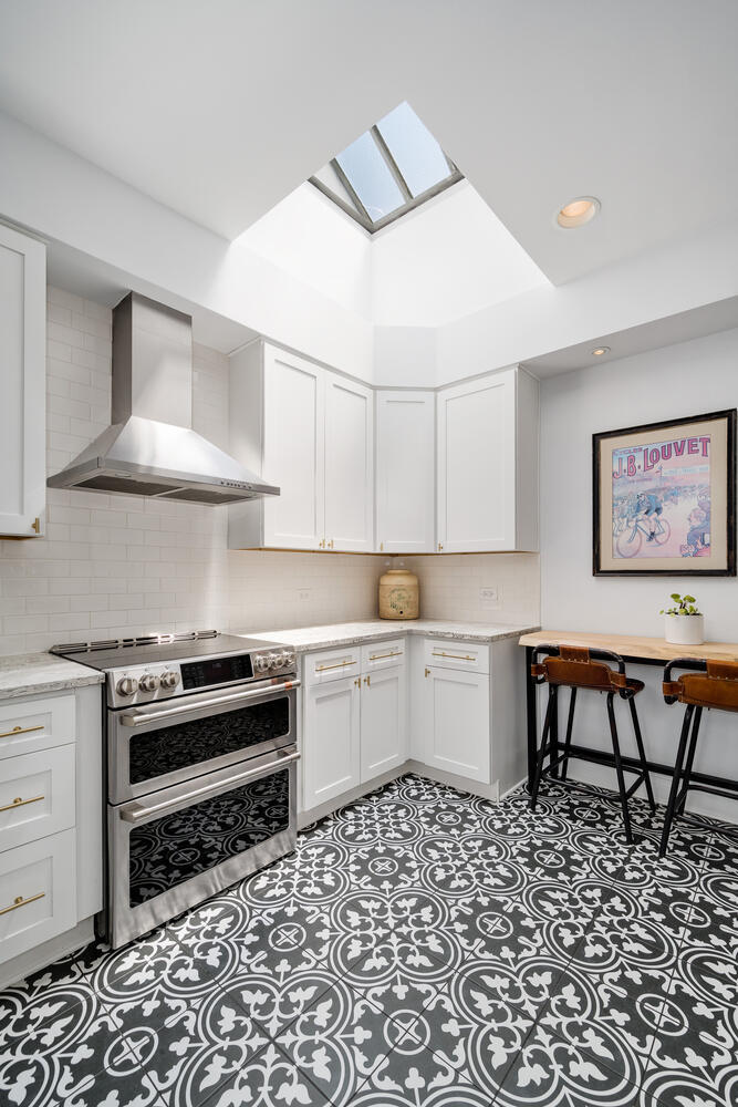 21 East Elm Street, Unit 3D Chicago, IL 60611 - Photo 14 of 27 a kitchen with a stove a sink and a refrigerator