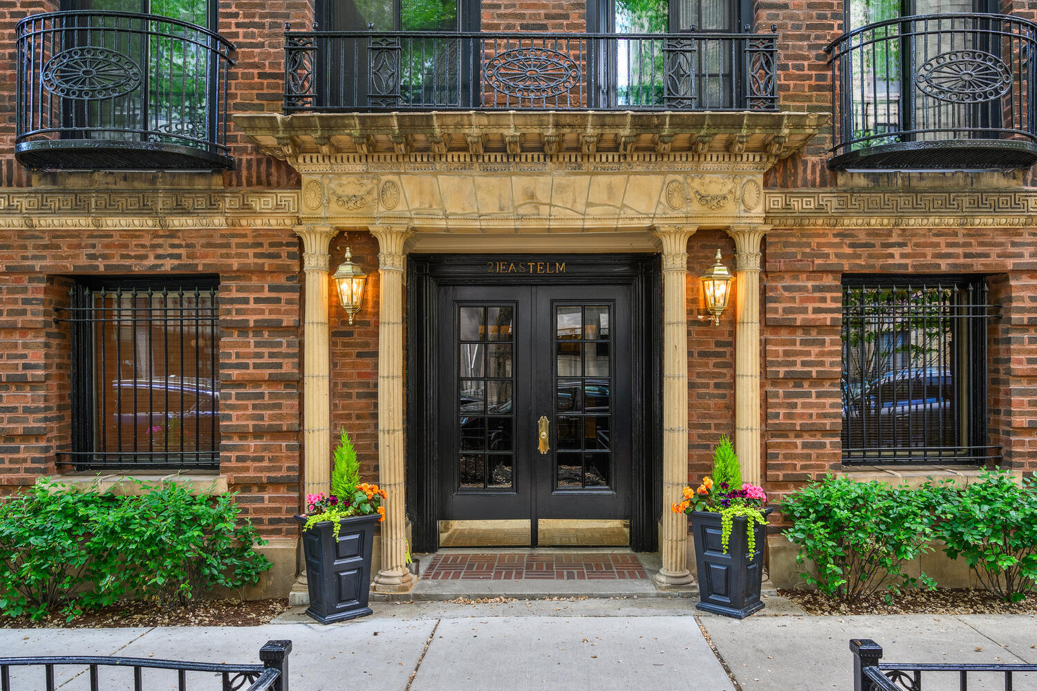 21 East Elm Street, Unit 3D Chicago, IL 60611 - Photo 2 of 27 a front view of a house with a garden