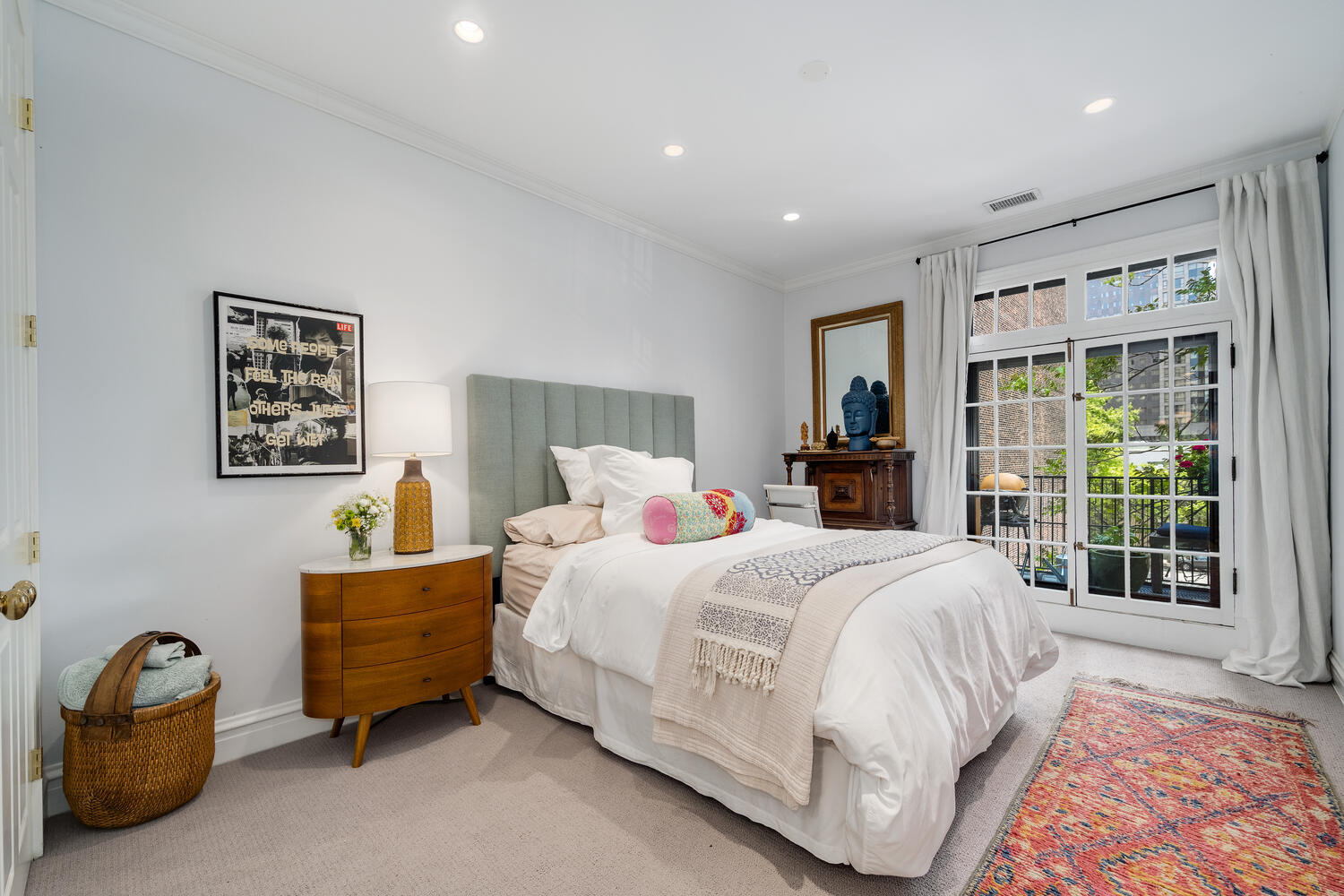 21 East Elm Street, Unit 3D Chicago, IL 60611 - Photo 22 of 27 a bedroom with a bed a couch and a window