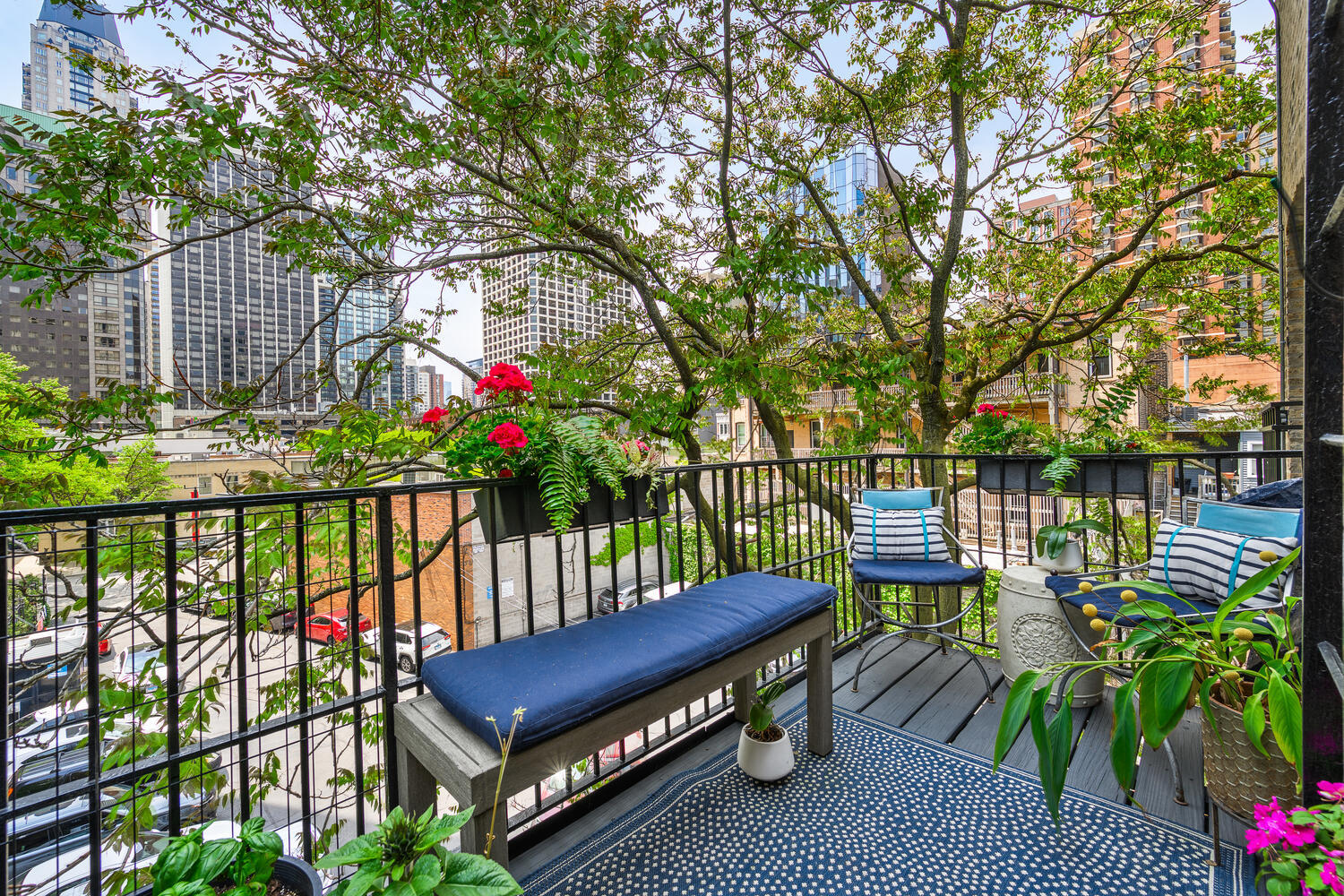 21 East Elm Street, Unit 3D Chicago, IL 60611 - Photo 25 of 27 a view of a balcony with wooden floor and outdoor seating