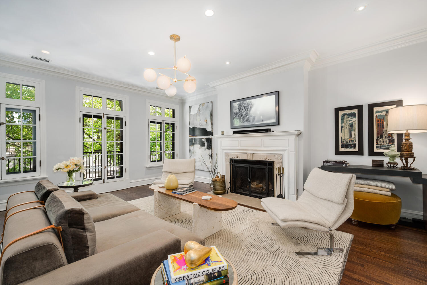 21 East Elm Street, Unit 3D Chicago, IL 60611 - Photo 5 of 27 a living room with furniture and a fireplace