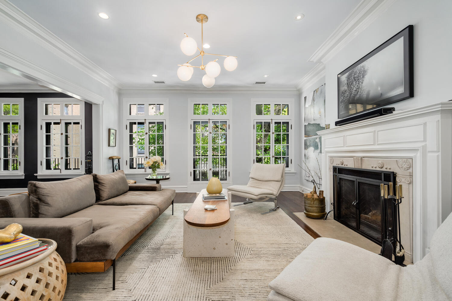 21 East Elm Street, Unit 3D Chicago, IL 60611 - Photo 6 of 27 a living room with furniture fireplace and flat screen tv