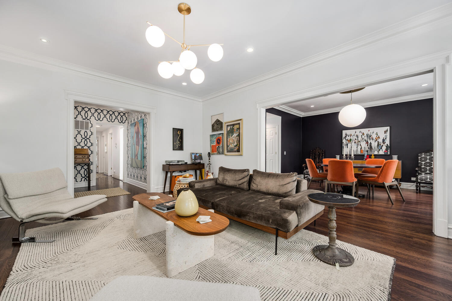 21 East Elm Street, Unit 3D Chicago, IL 60611 - Photo 9 of 27 a living room with furniture and a chandelier