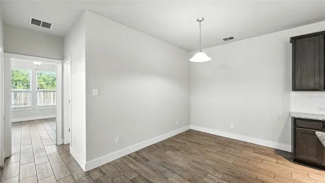a bathroom with a sink toilet and mirror