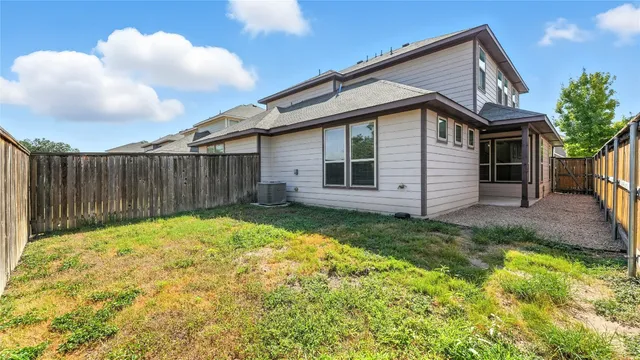 an aerial view of a house with garden space and lake view