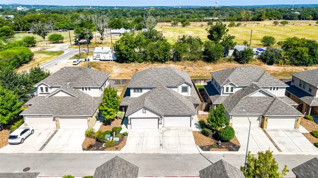 a view of a room with wooden floors
