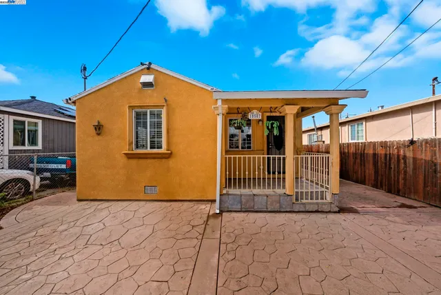 a view of porch with a small yard
