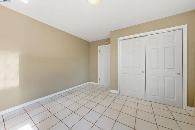 a bathroom with a sink a toilet a mirror and shower