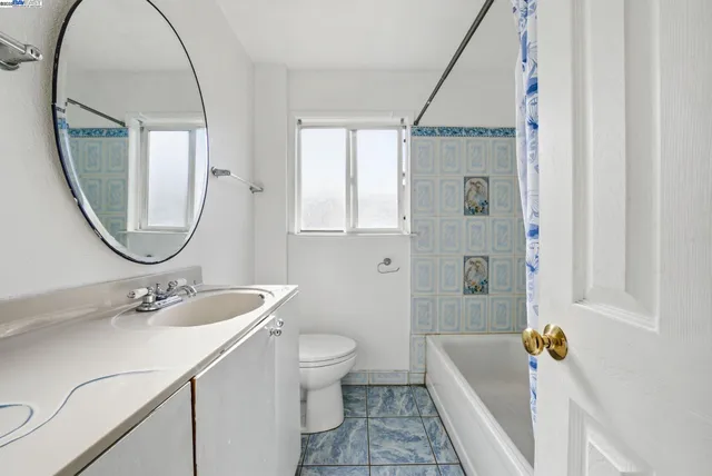 a view of a hallway with a stairs