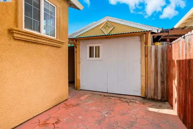 a view of a house with backyard and deck