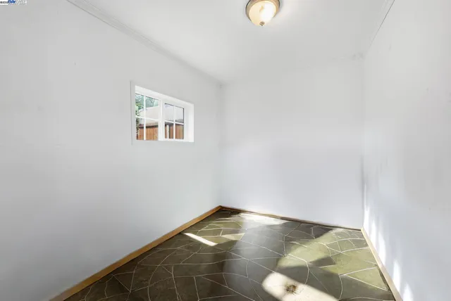 a bedroom with a bed and a potted plant