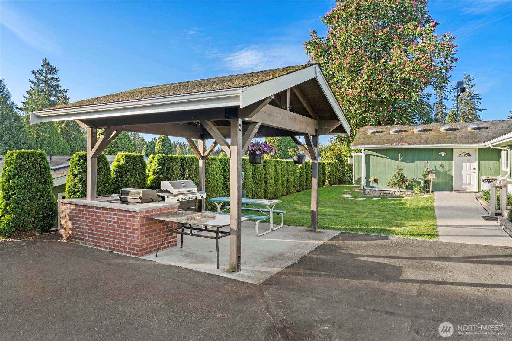 23825 15th Avenue Southeast, Unit 108 Bothell, WA 98021 - Photo 24 of 39 a view of house with backyard and porch