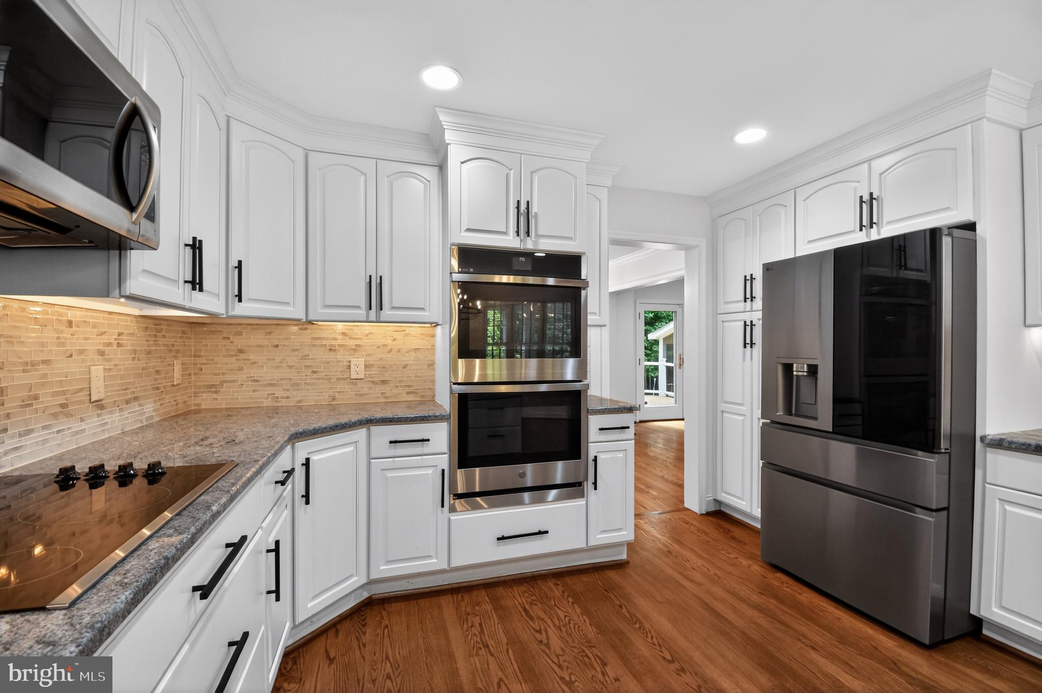 11728 Stuart Mill Road Oakton, VA 22124 - Photo 6 of 68 Modern elegance in a bright kitchen.