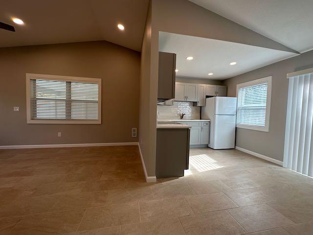 3166 Southeast Garden Street, Unit 3166 Stuart, FL 34997 - Photo 3 of 10 a view of kitchen with refrigerator and microwave