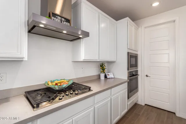 a kitchen with a sink and a large window