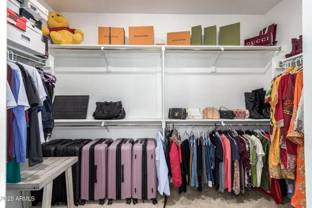 a bathroom with a granite countertop sink mirror vanity and toilet