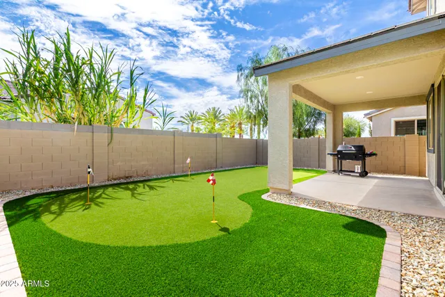 a view of a swimming pool and an outdoor seating