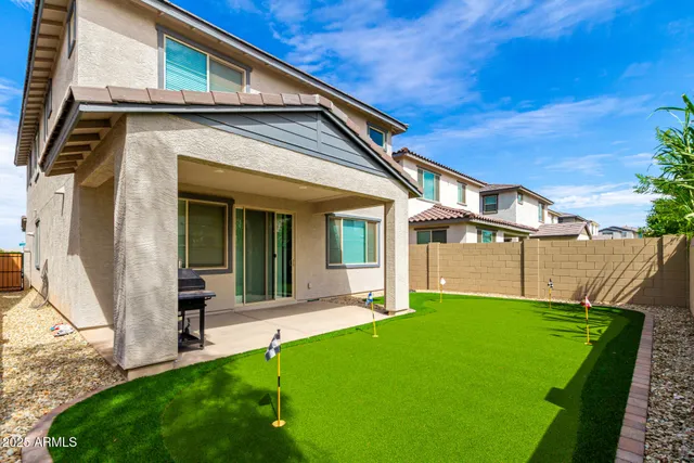 a view of swimming pool with outdoor seating and a patio