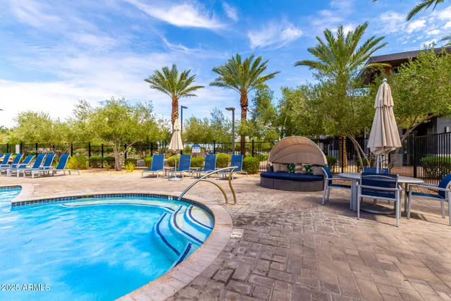 a view of a patio with dining table and chairs with wooden floor
