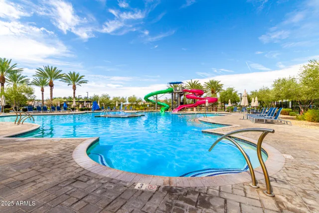 a view of swimming pool with outdoor seating
