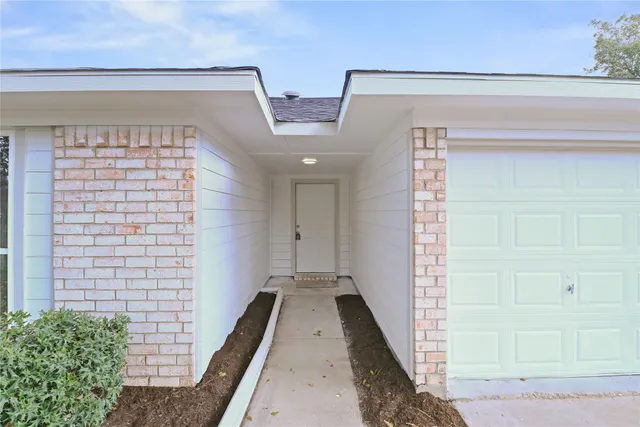 a view of a hallway with entryway
