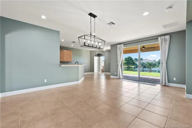 a view of room with window and ceiling fan