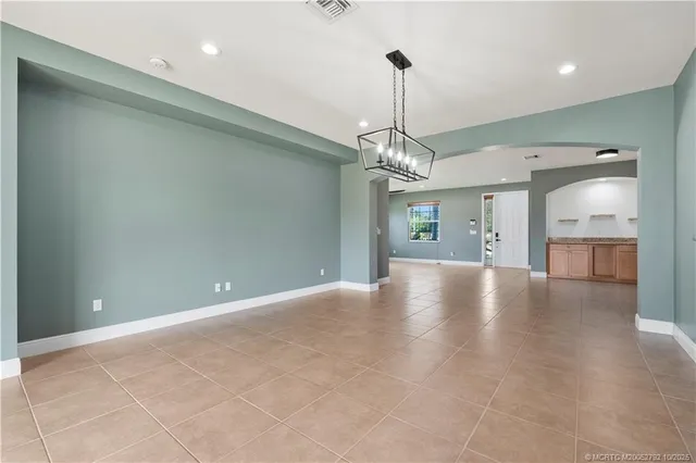 a view of a livingroom with a chandelier fan