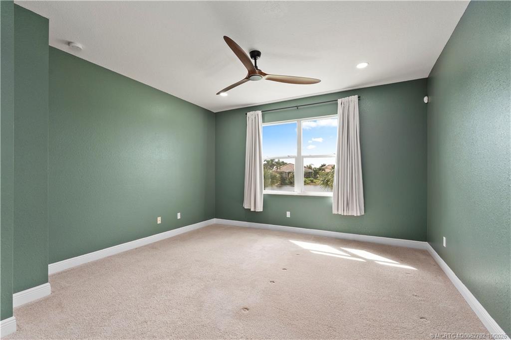 1455 Southeast Conference Circle Stuart, FL 34997 - Photo 23 of 69 a view of room with window and ceiling fan