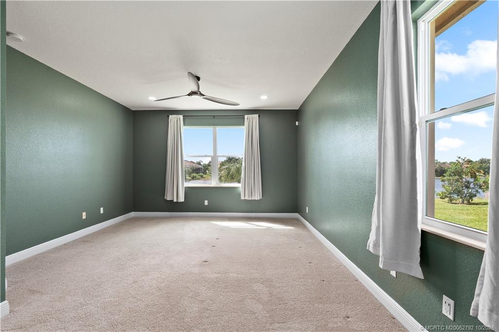 1455 Southeast Conference Circle Stuart, FL 34997 - Photo 24 of 69 an empty room with windows and closet