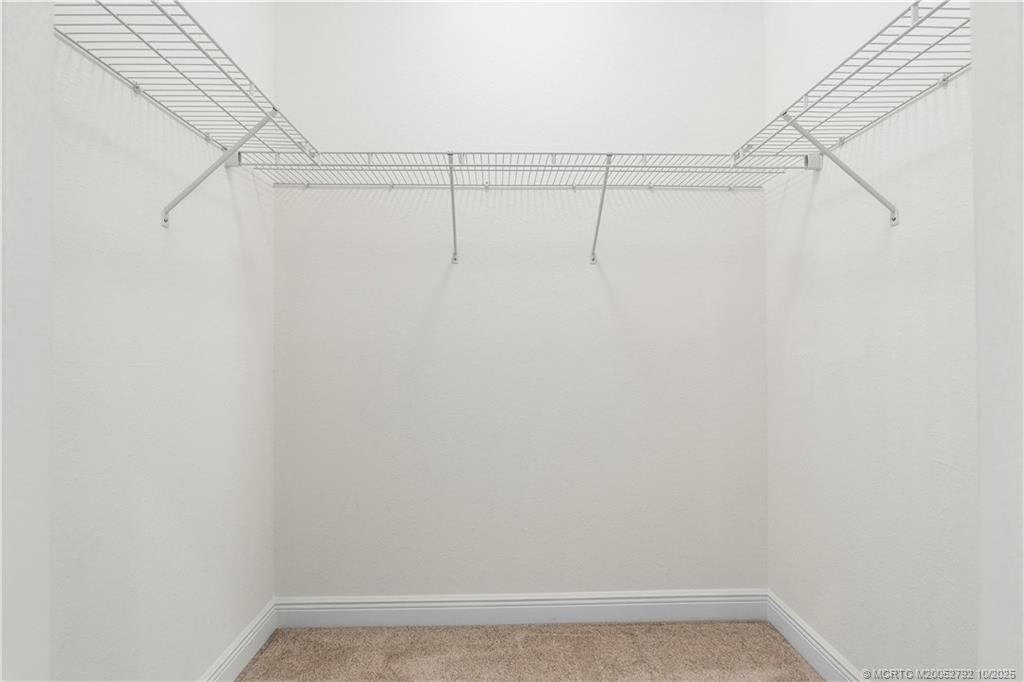 1455 Southeast Conference Circle Stuart, FL 34997 - Photo 30 of 69 a view of a room with racks on the wall